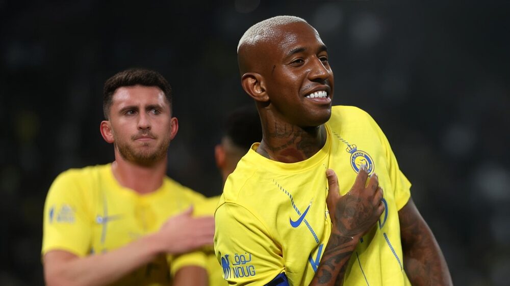 Anderson Talisca of Al-Nassr celebrates with teammates after scoring his team’s second goal during the friendly between Al-Nassr and Inter Miami at Kingdom Arena on February 01, 2024 in Riyadh, Saudi Arabia. Lionel Messi watches on.